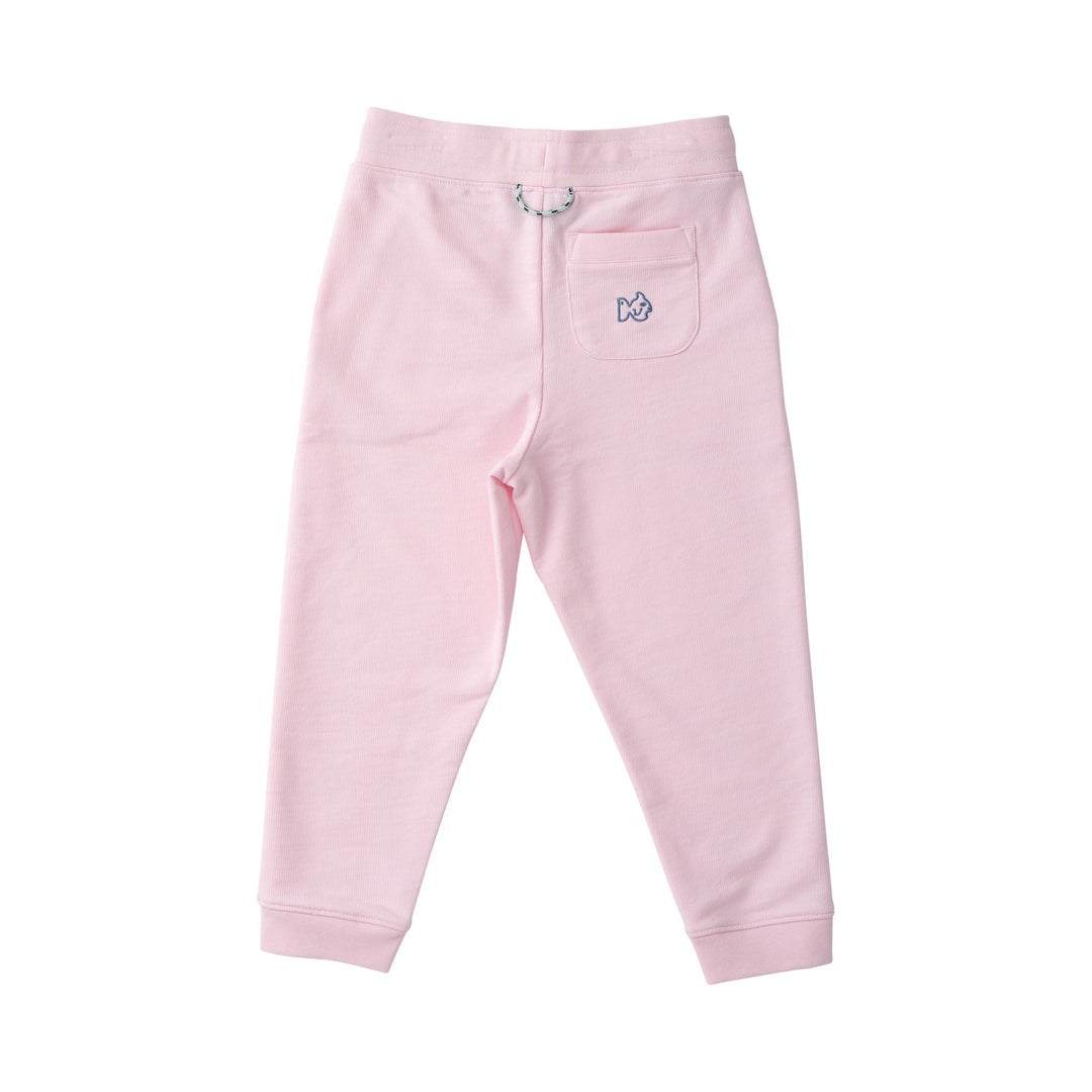 Pink sweatpants with a small logo on a white background