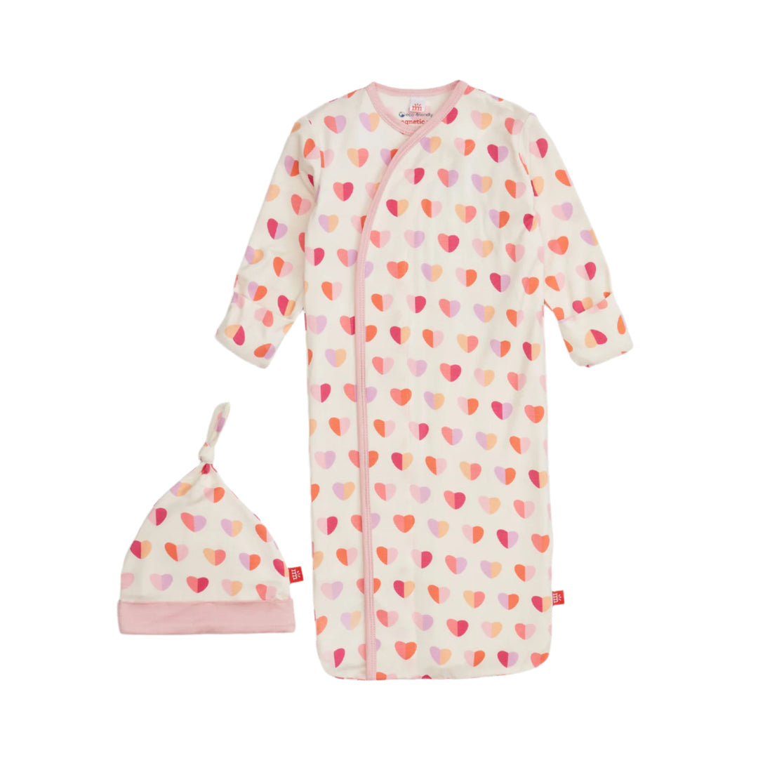 Baby gown with heart pattern and matching hat on a white background