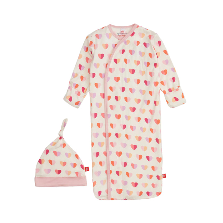 Baby gown with heart pattern and matching hat on a white background