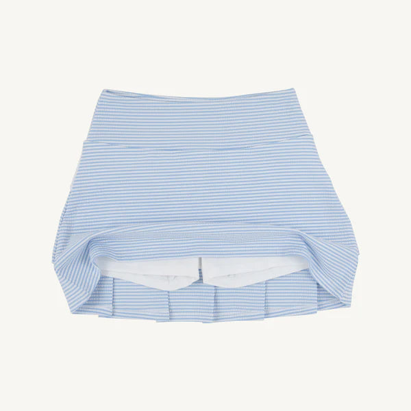 Blue and white striped skirt on a light gray background