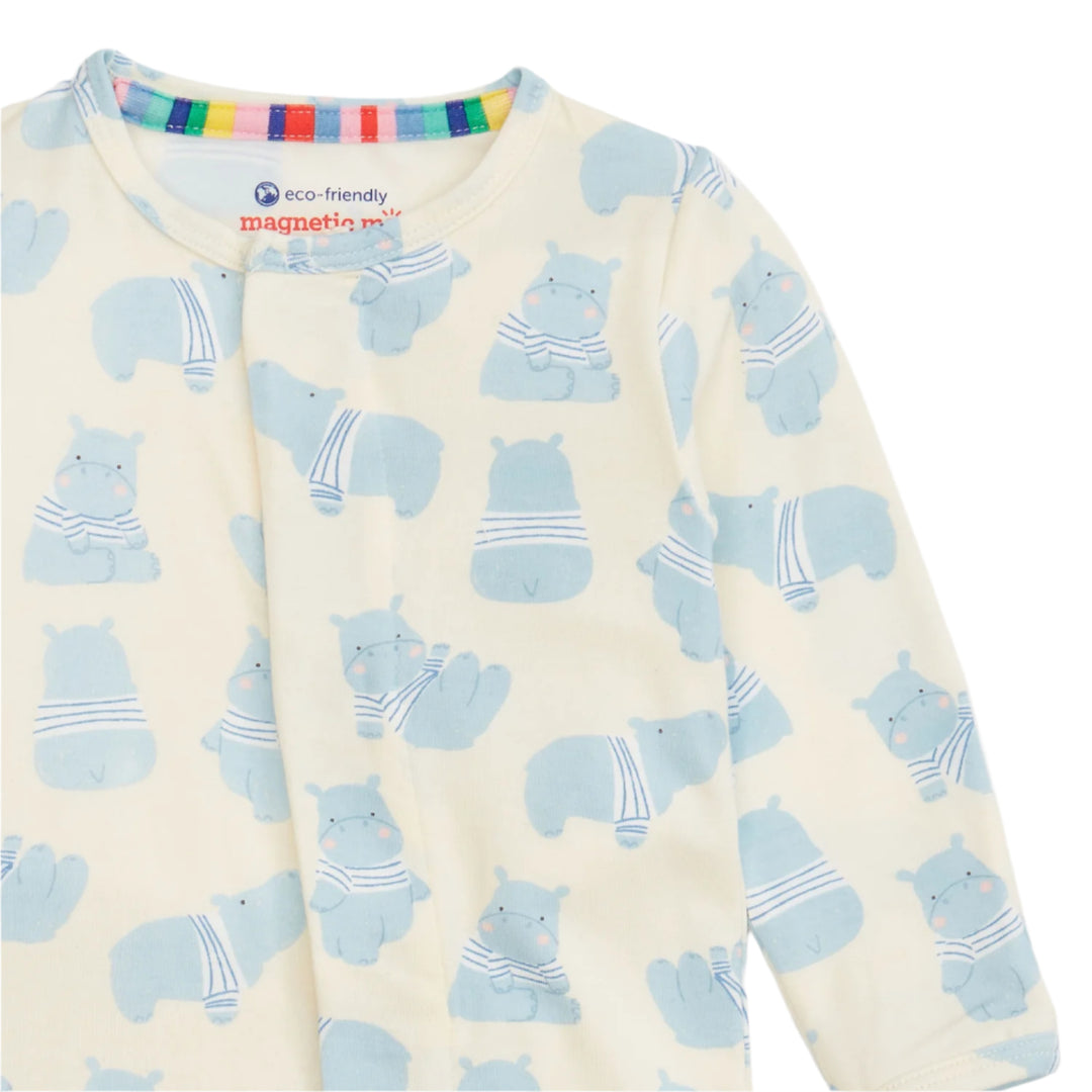 baby boy footie with blue hippos on white background