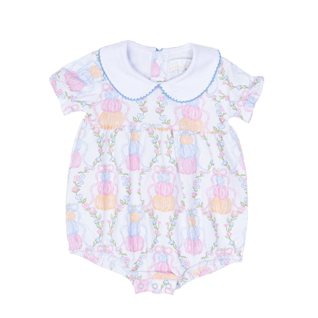 Baby romper with pastel floral pattern on a white background