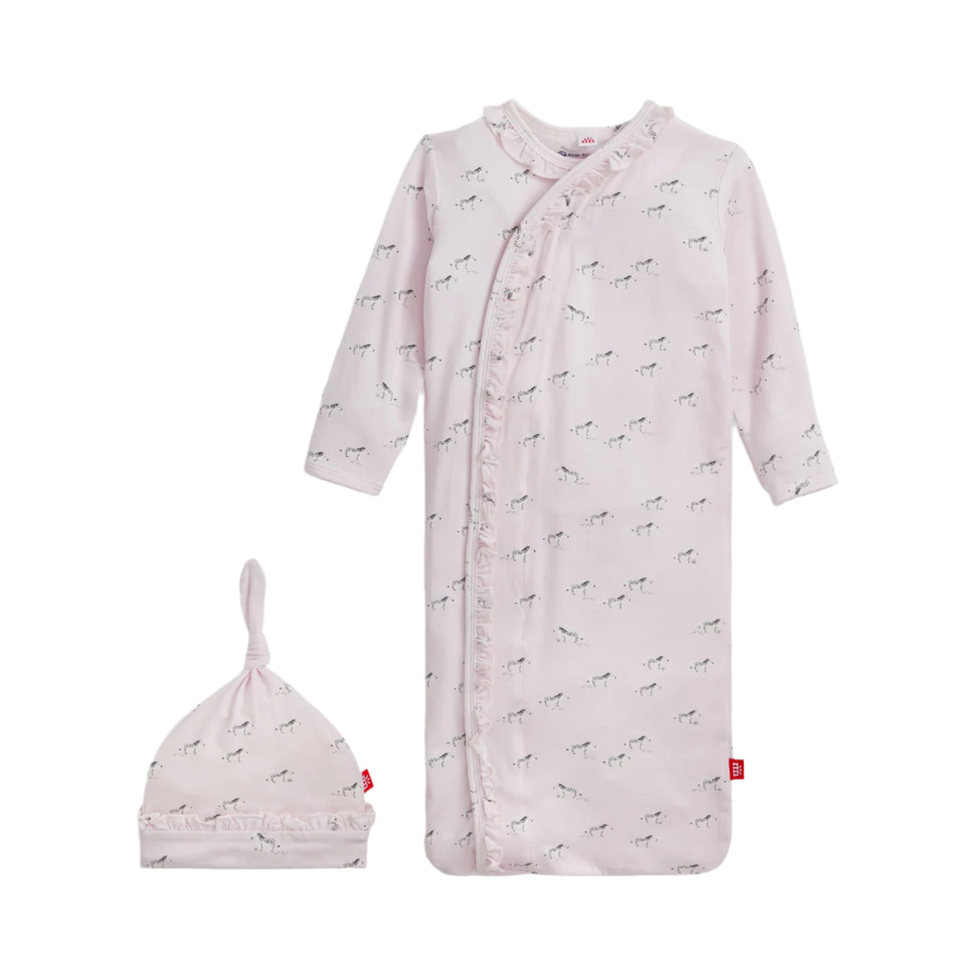 Baby gown set with pink long-sleeve shirt and hat on a white background