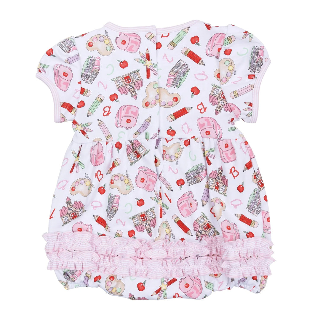 Baby romper with cosmetic pattern on a white background