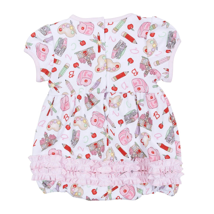 Baby romper with cosmetic pattern on a white background