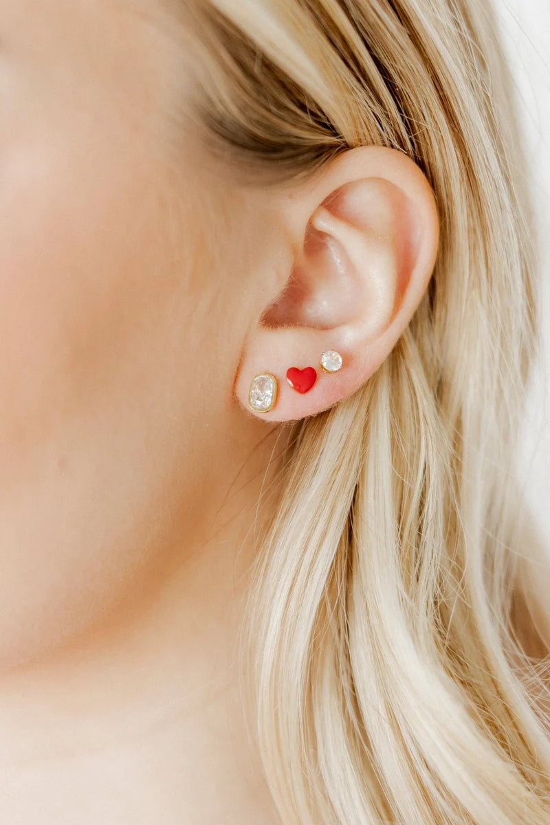Kay clear crystal gold screwback stud earring styled in a delicate ear stack