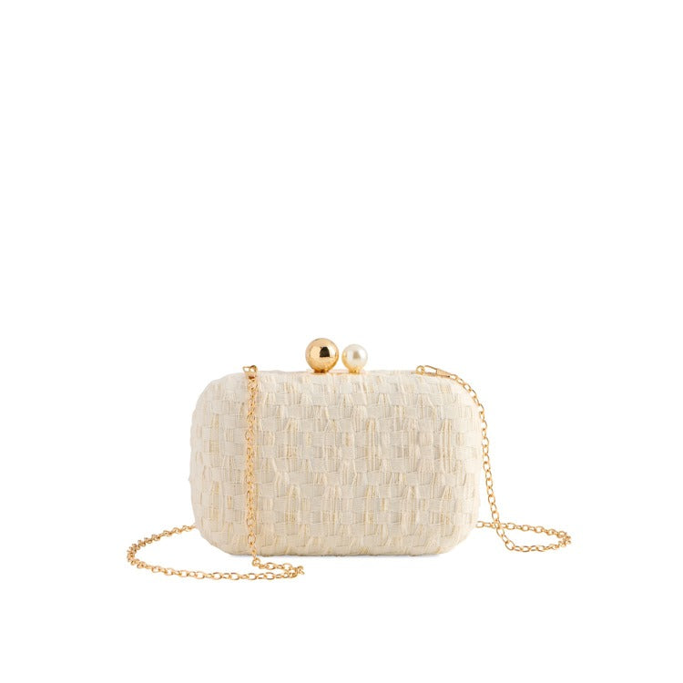 Ivory woven clutch with pearl and gold kiss-lock closure and detachable gold chain strap | Walker Boutique