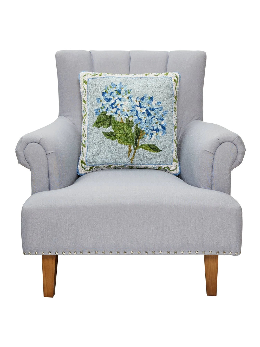 hydrangea hook pillow on chair