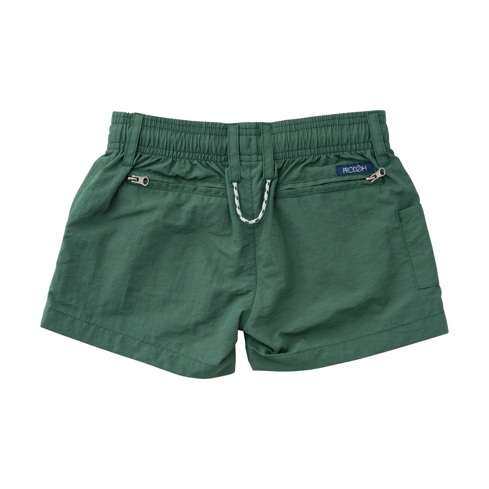 Green shorts with a brand label on a white background