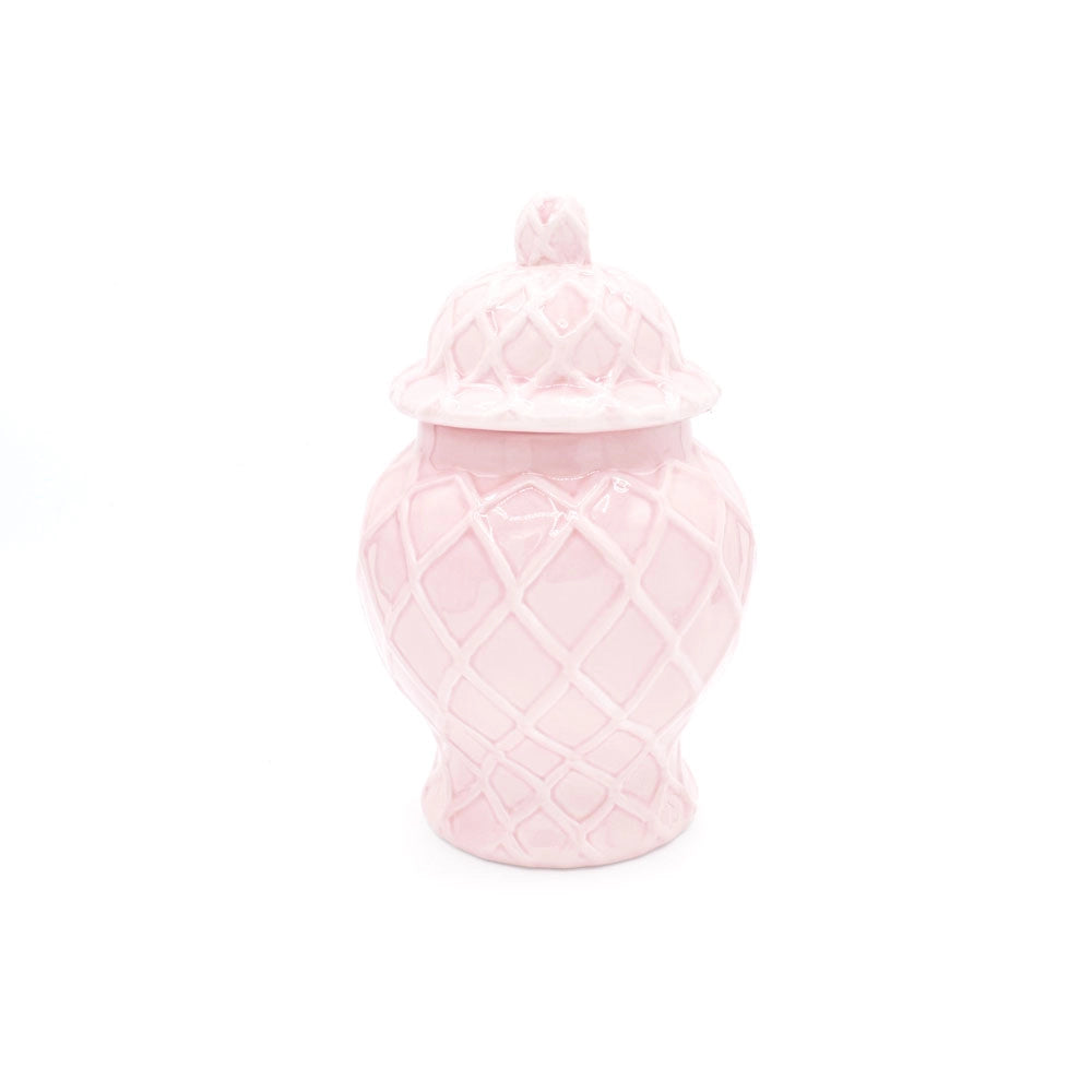 Pink textured jar with a lid on a white background