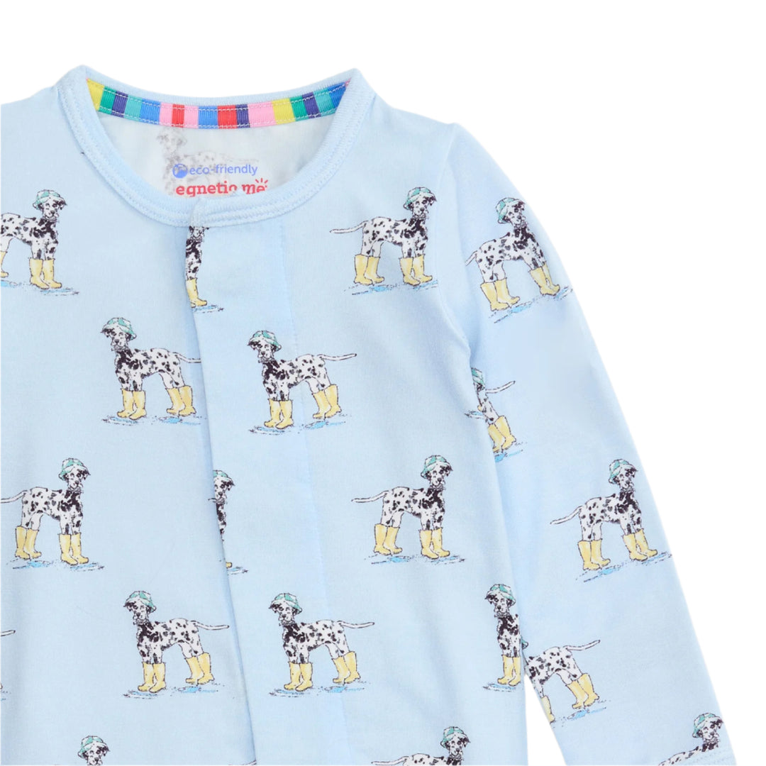 Light blue long-sleeve footie with Dalmatian dog pattern on a light blue background