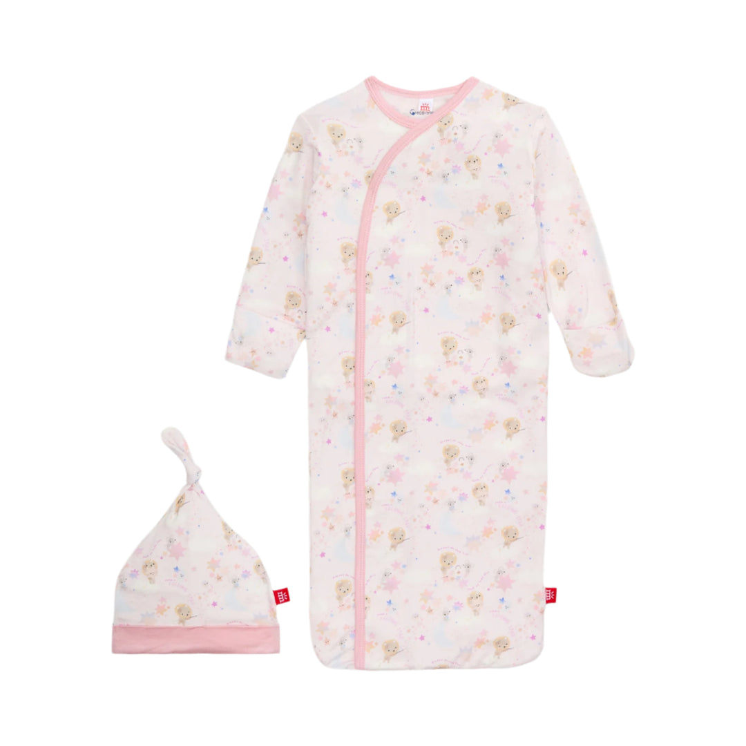 Baby gown and hat set with floral pattern on a white background