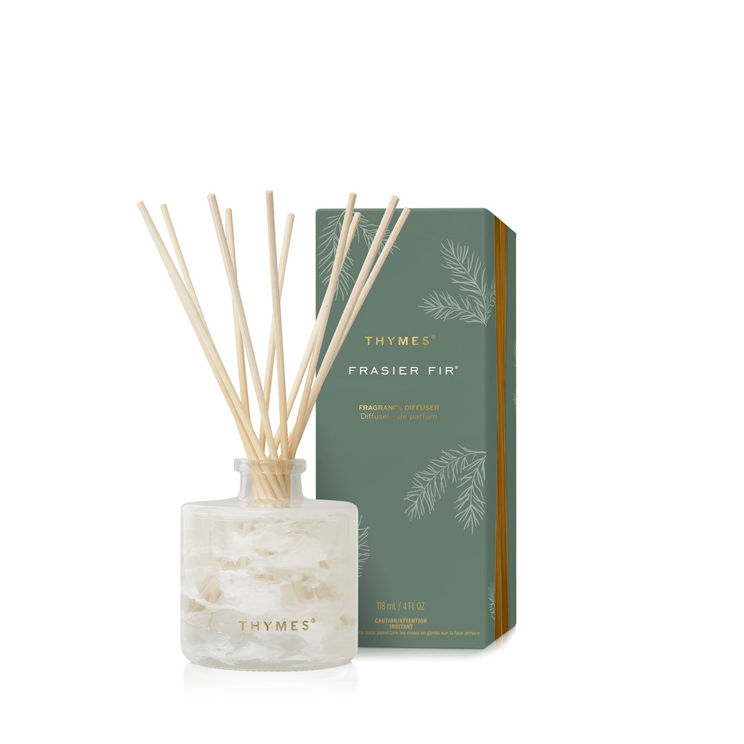 Frasier Fir Tidings 4 fluid ounce diffuser in white marbled glass with natural reeds and green box