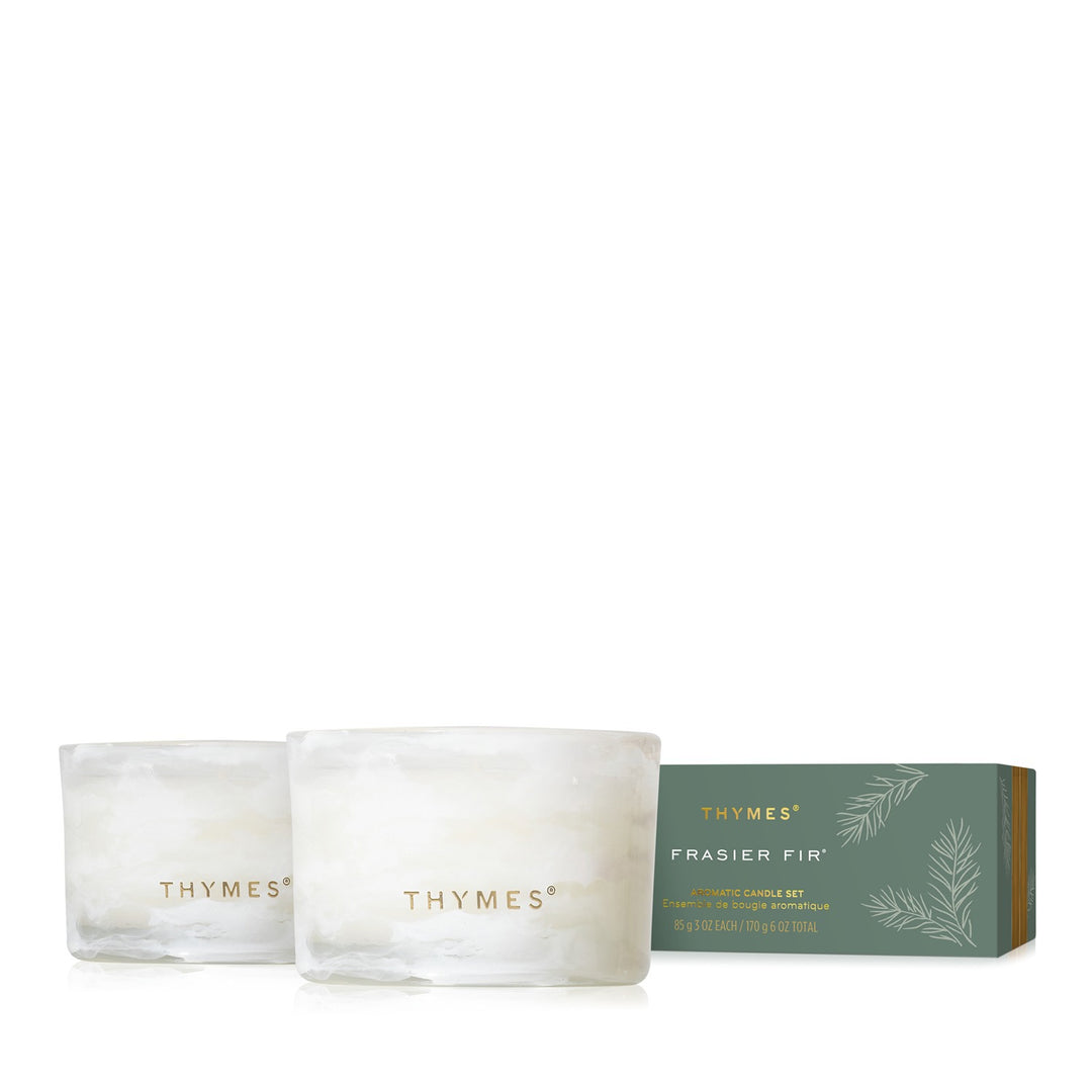 Frasier Fir Tidings gift set with two white marbled glass votive candles and long green box