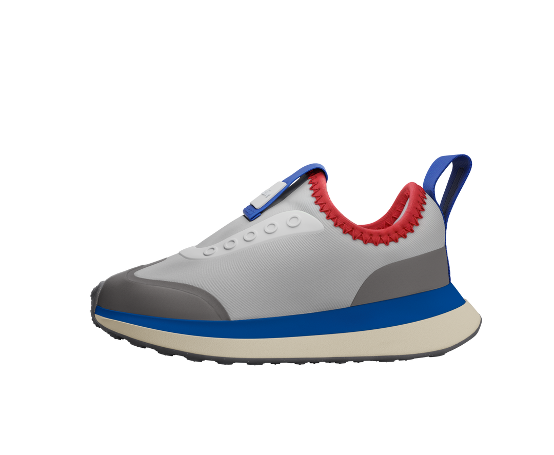 Gray sneaker with blue and red accents on a white background