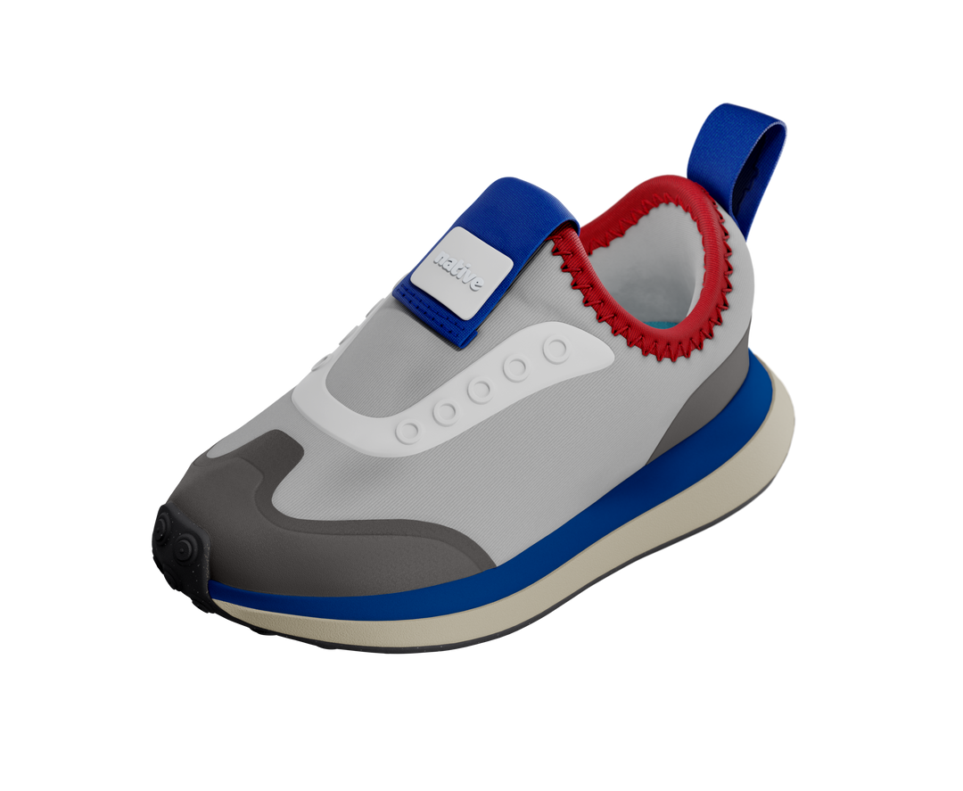 Children's shoe with gray, blue, and red design on a white background