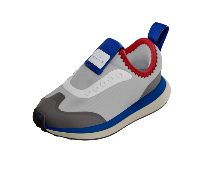 Children's shoe with gray, blue, and red design on a white background