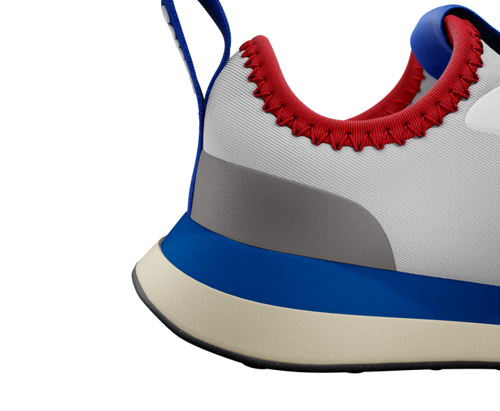 Close-up of a sneaker with red interior, blue and gray sole on a white background