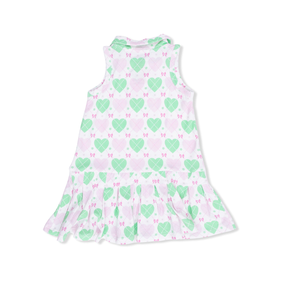 Children's sleeveless dress with green heart and pink bow pattern on a white background