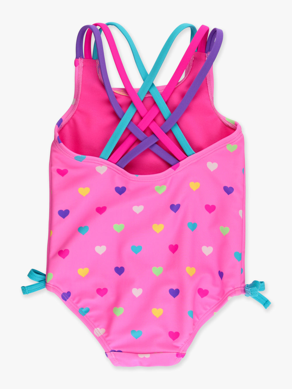 Pink swimsuit with colorful heart pattern and criss-cross straps on a white background