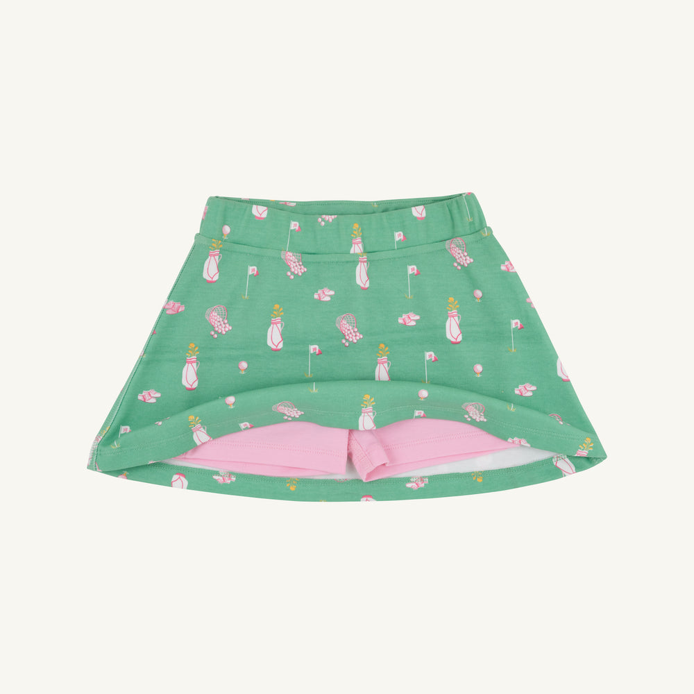GREEN SKORT WITH PINK GOLF MOTIFS SHOWING PINK UNDER SHORTS