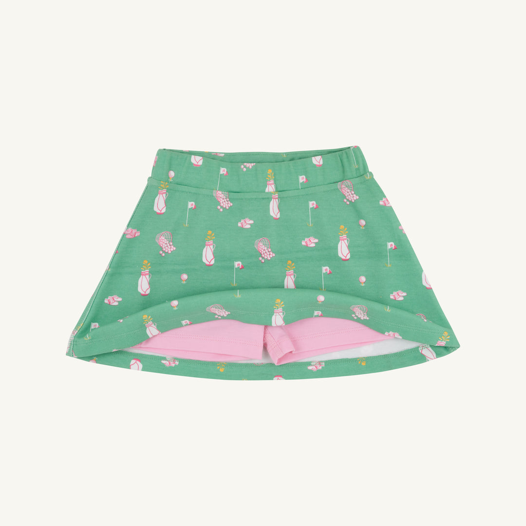 GREEN SKORT WITH PINK GOLF MOTIFS SHOWING PINK UNDER SHORTS