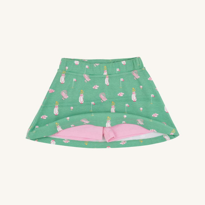 GREEN SKORT WITH PINK GOLF MOTIFS SHOWING PINK UNDER SHORTS