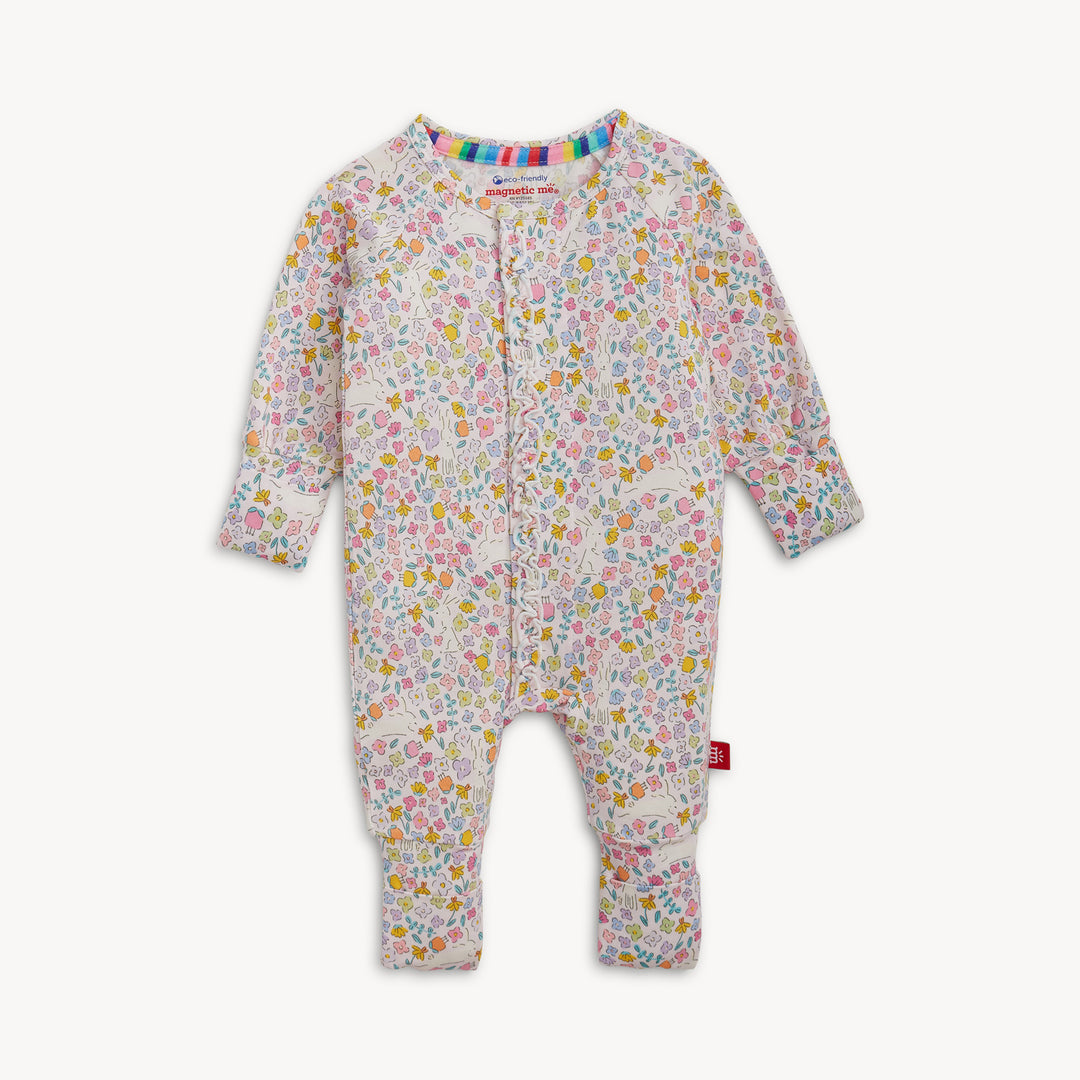 Floral patterned baby onesie on a white background