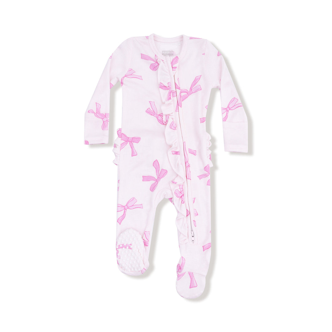 Baby onesie with pink bow pattern on a white background