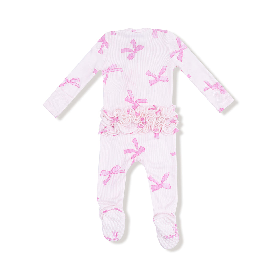 Baby onesie with pink floral and bow pattern on a white background