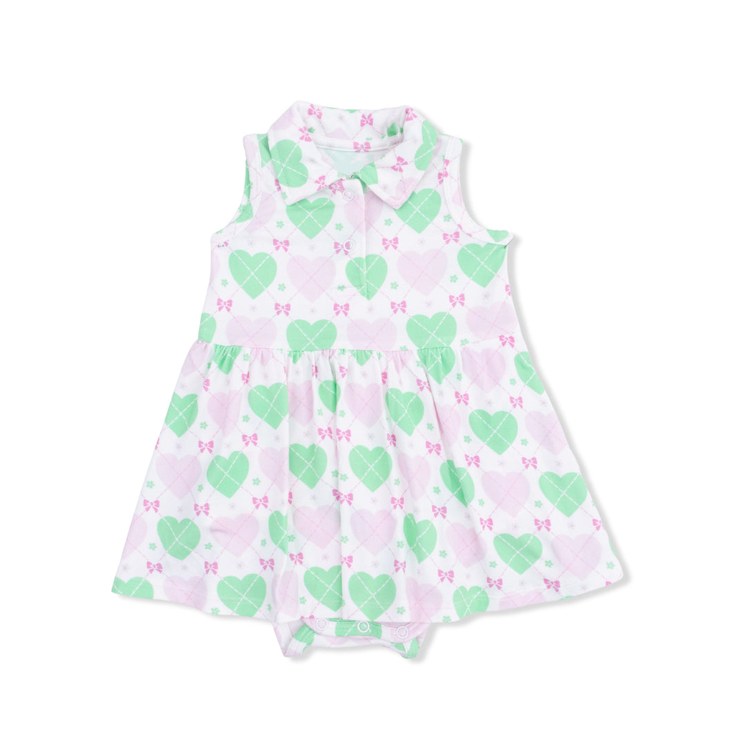 Baby dress with green heart and pink butterfly pattern on a white background