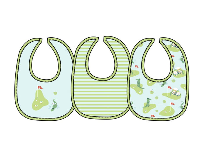 Three baby bibs lined up side by side on a plain white background. The left bib is light blue with a green outline and a golf graphic.
