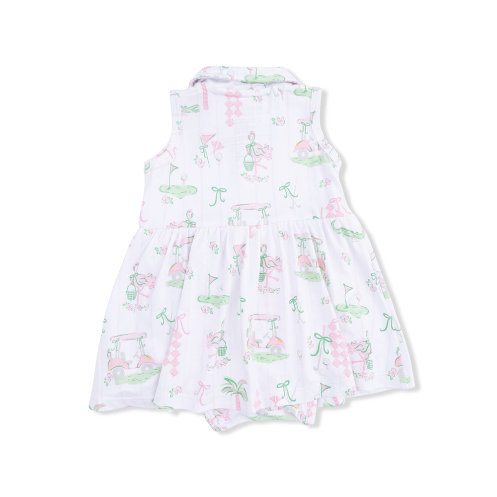 White dress with colorful flamingo pattern on a white background