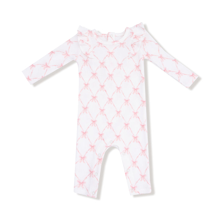 White baby onesie with pink geometric pattern on a white background