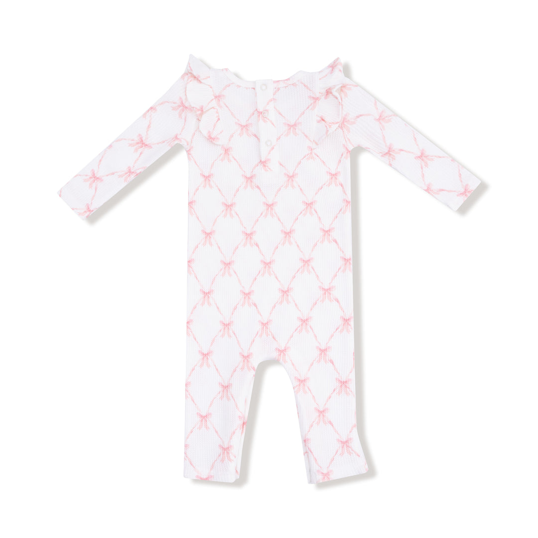 White baby onesie with pink star pattern on a white background