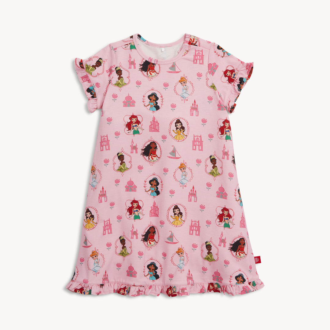 Pink children's nightgown with princess and castle pattern on a white background
