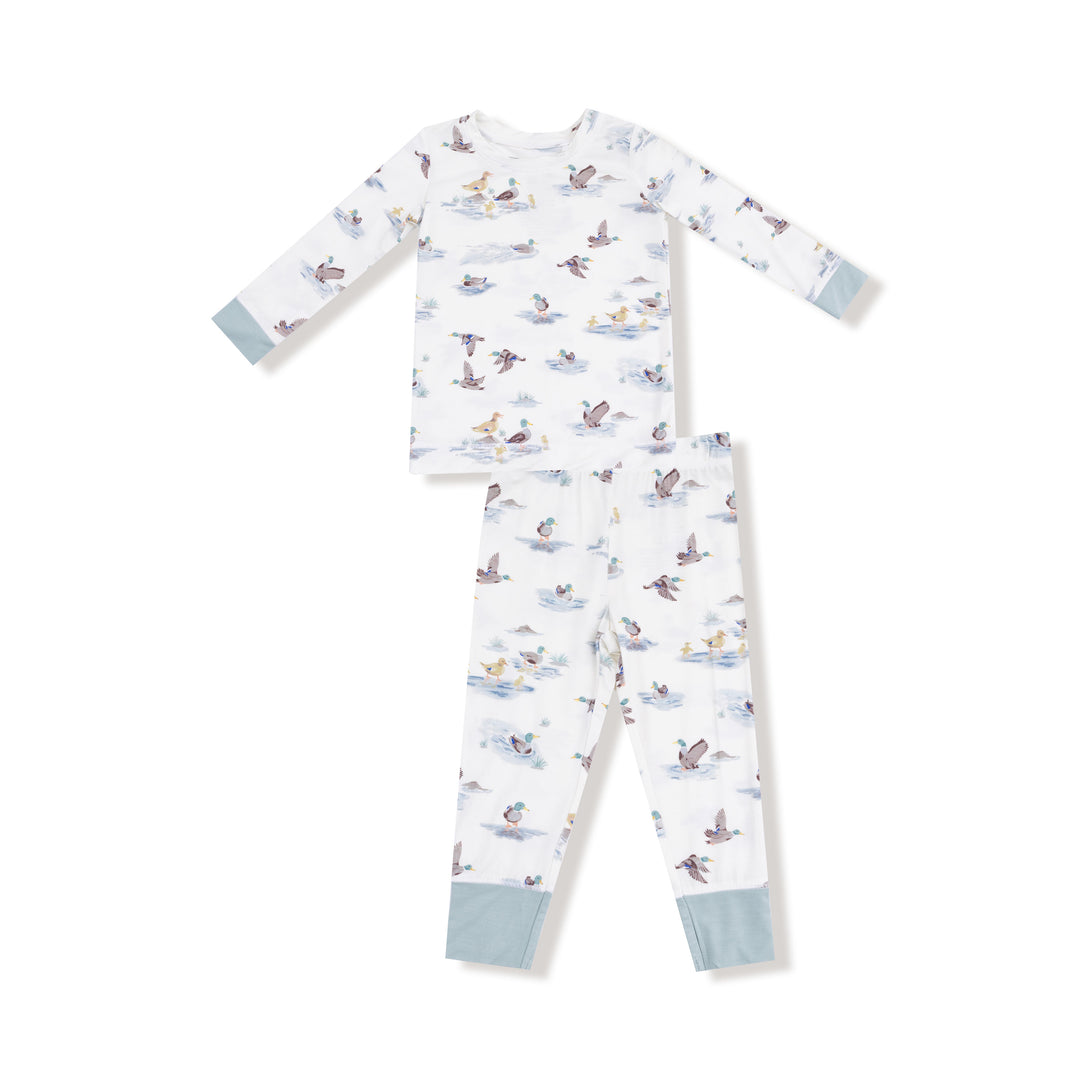 Children's pajama set with animal pattern on a white background