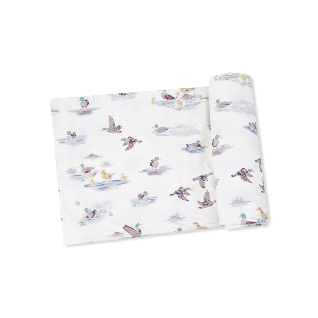 Soft fabric with duck pattern on a white background