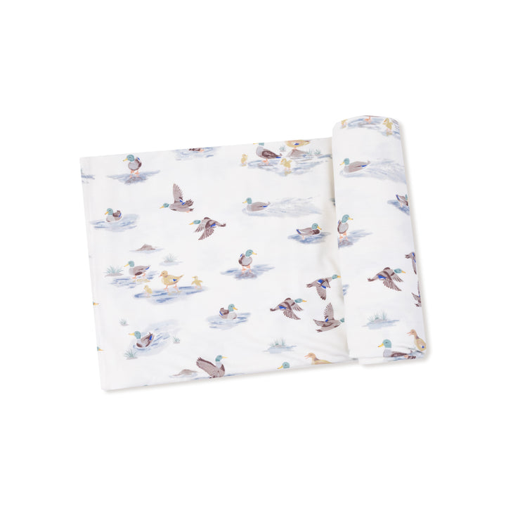 Soft fabric with duck pattern on a white background