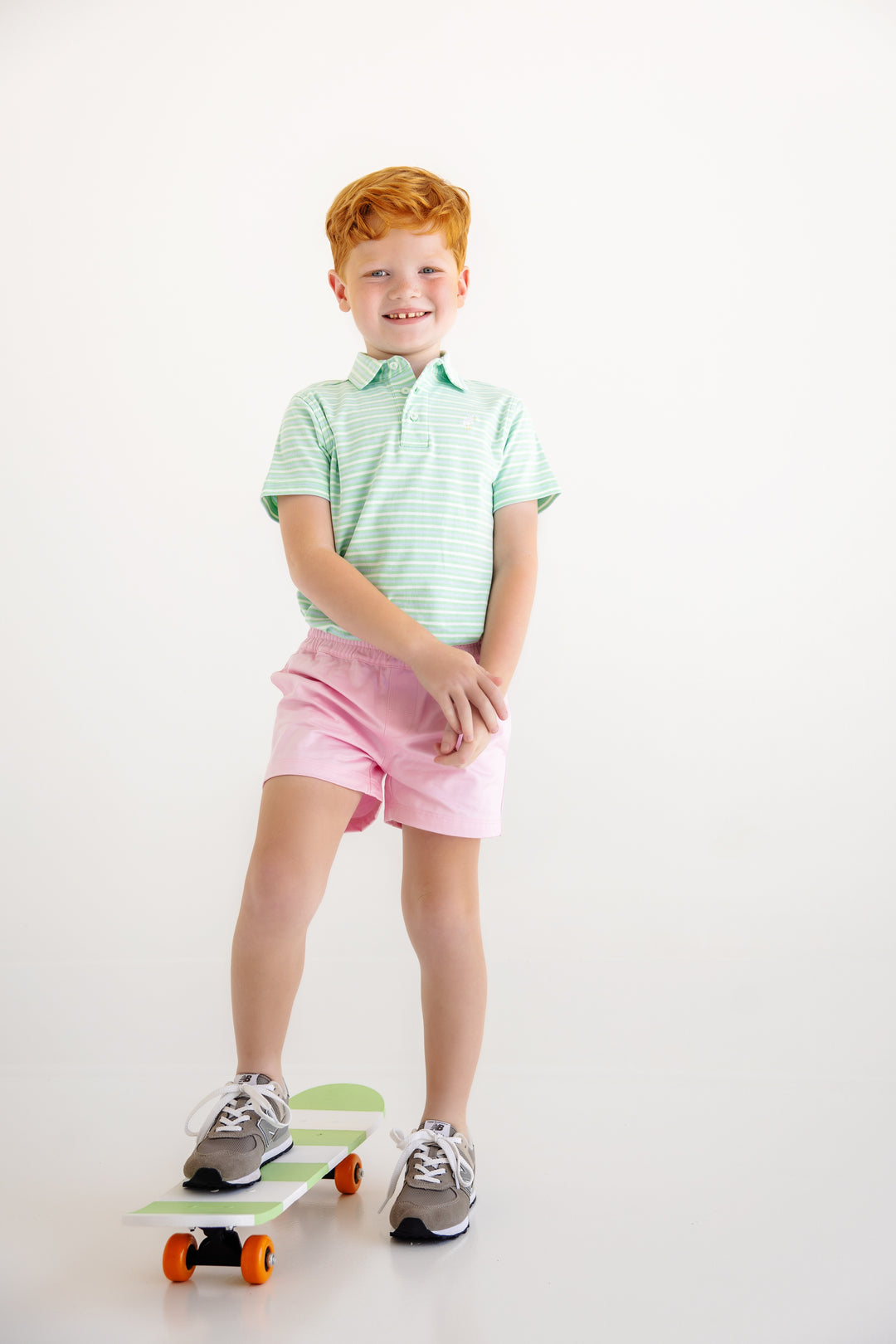 GREEN STRIPE BOYS POLO STYLED SHOT ON LITTLE BOY