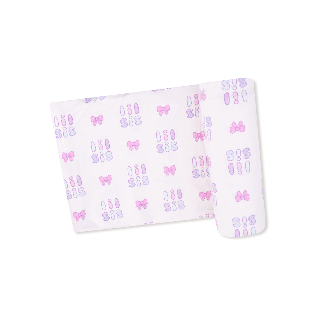 White pouch with 'SIS' and bow patterns on a white background