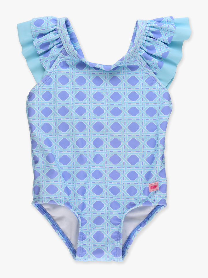 Blue polka dot swimsuit with ruffled shoulders on a white background