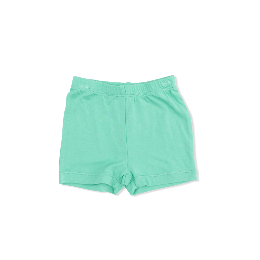 Kelly green shorts on a white background