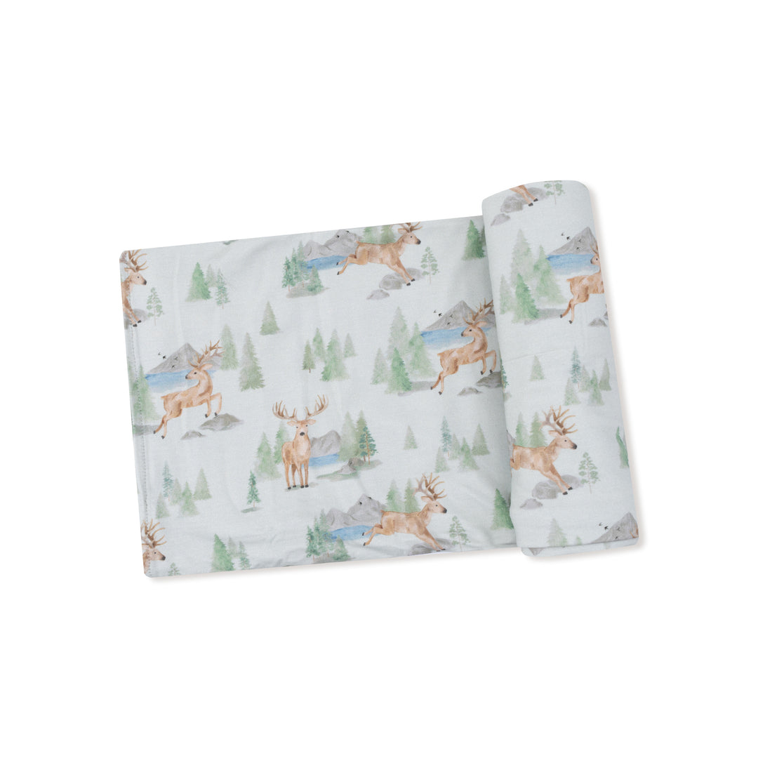 fabric with deer and nature pattern on a white background