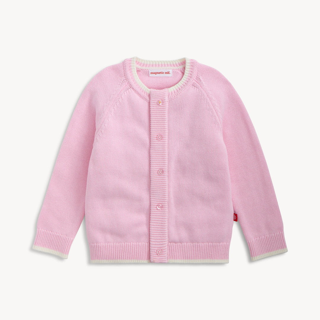 LITTLE GIRLS PINK CARDIGAN WITH WHITE TRIM ON WHITE BACKGROUND

