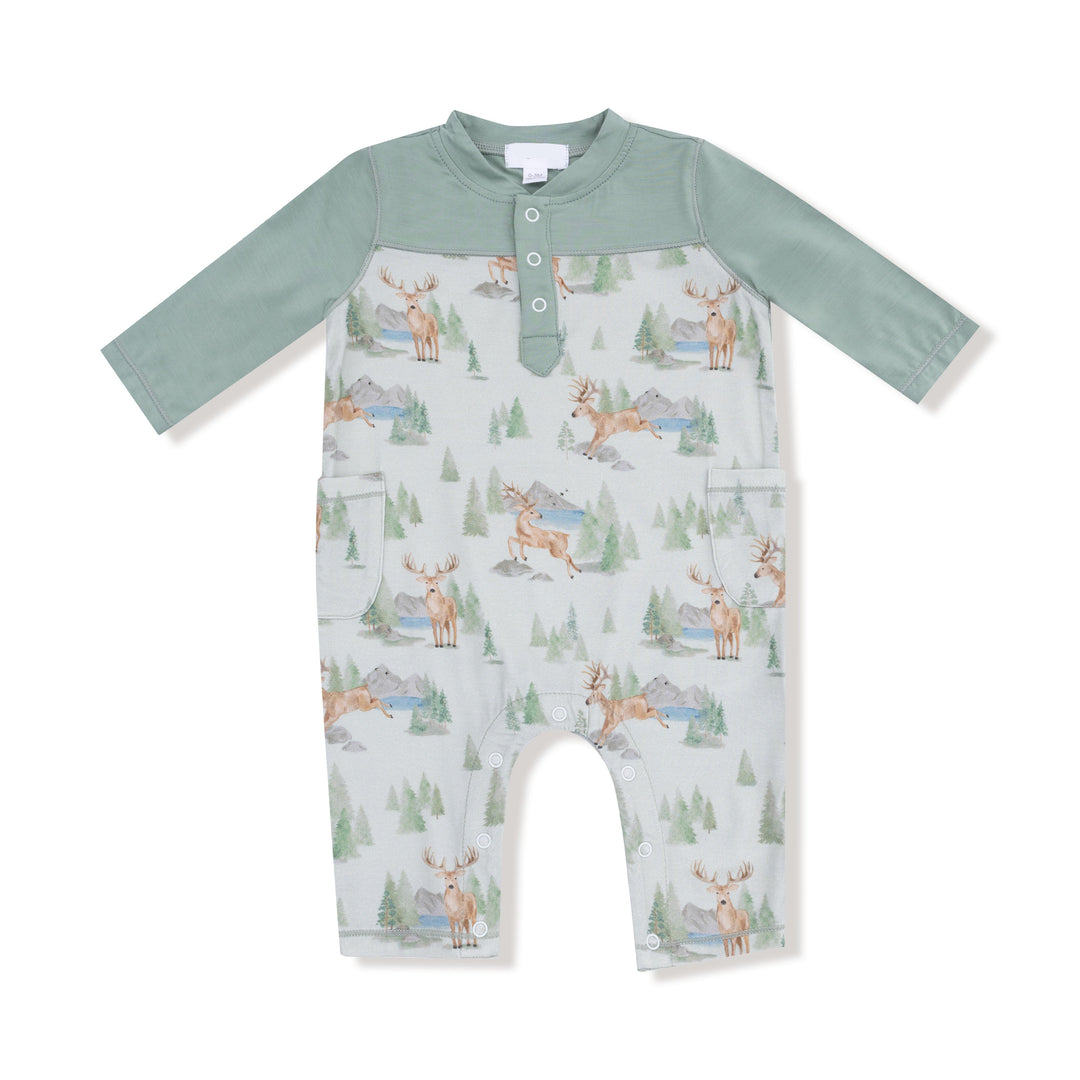 Baby romper with deer and nature pattern on a white background