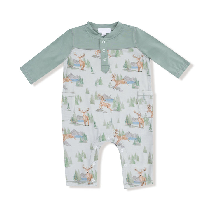Baby romper with deer and nature pattern on a white background