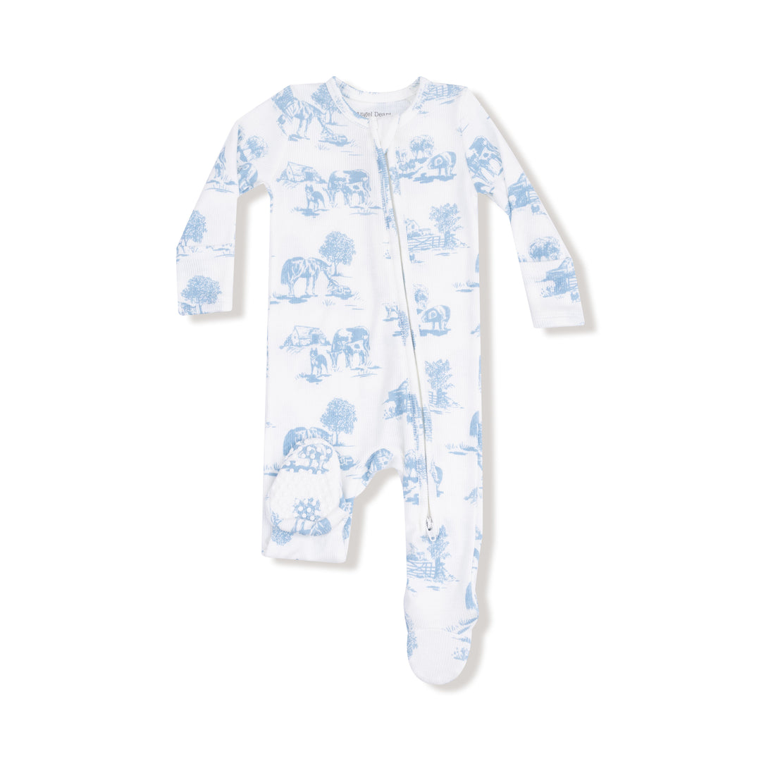 White baby onesie with blue animal pattern on a white background