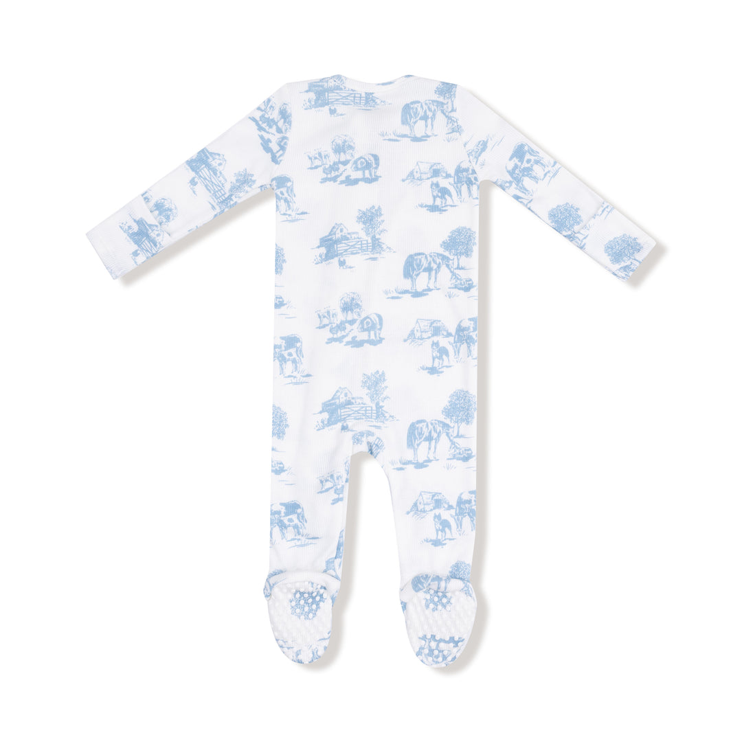 White baby onesie with blue animal pattern on a white background