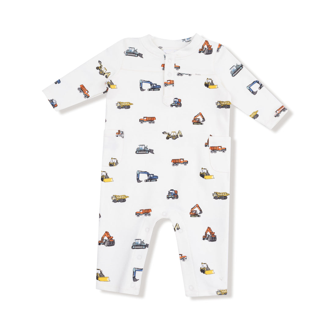 White baby onesie with construction vehicle pattern on a white background